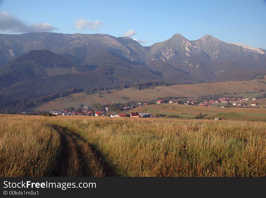 Mountain landscape with village and peaks