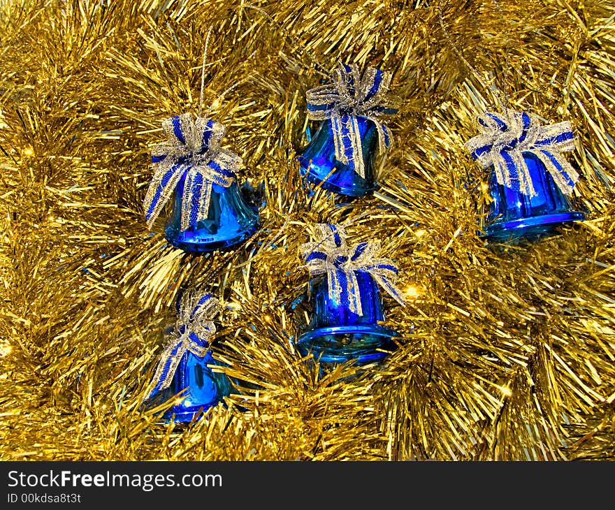 Blue Christmas bells in a golden decoration. Blue Christmas bells in a golden decoration