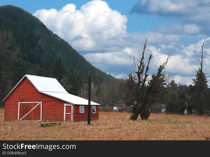 Red Barn with Cloudy Blue Sky