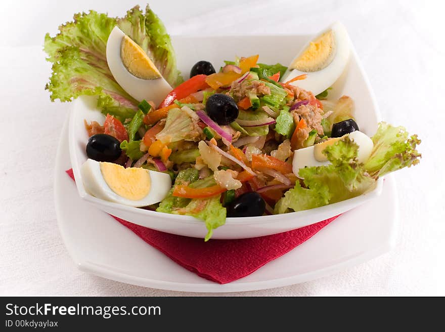 Fresh salad with eggs and olives