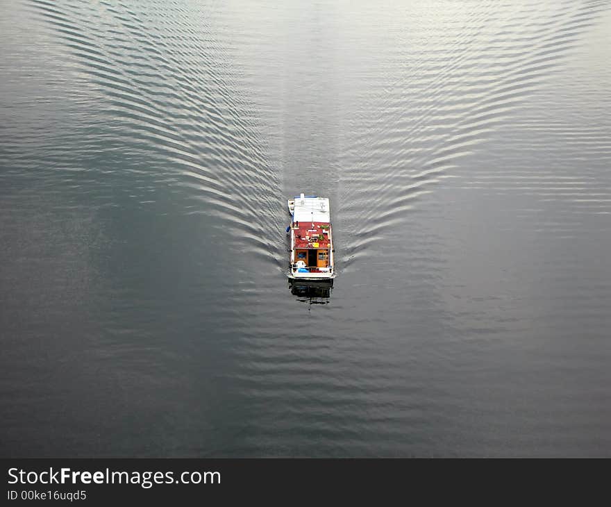 Small boat in the middle of river