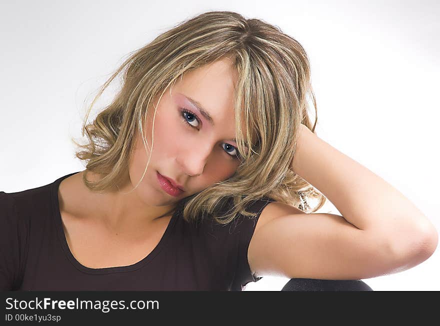 Portrait of the beautiful girl on a white background