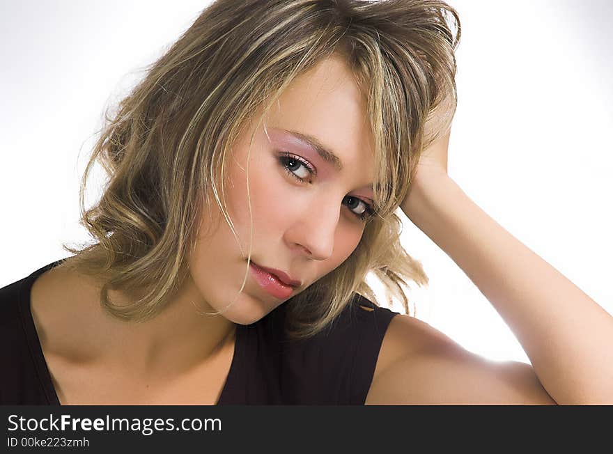 Portrait of the beautiful girl on a white background