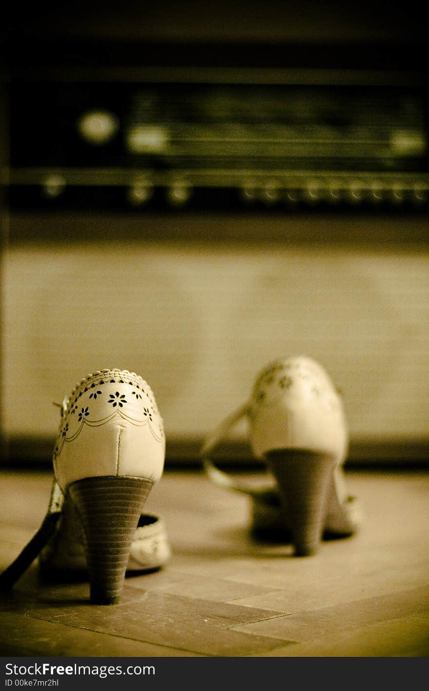 Shoes with an old radio in the background. Shoes with an old radio in the background