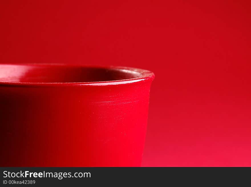 Photo of red vessel isolated on the red background