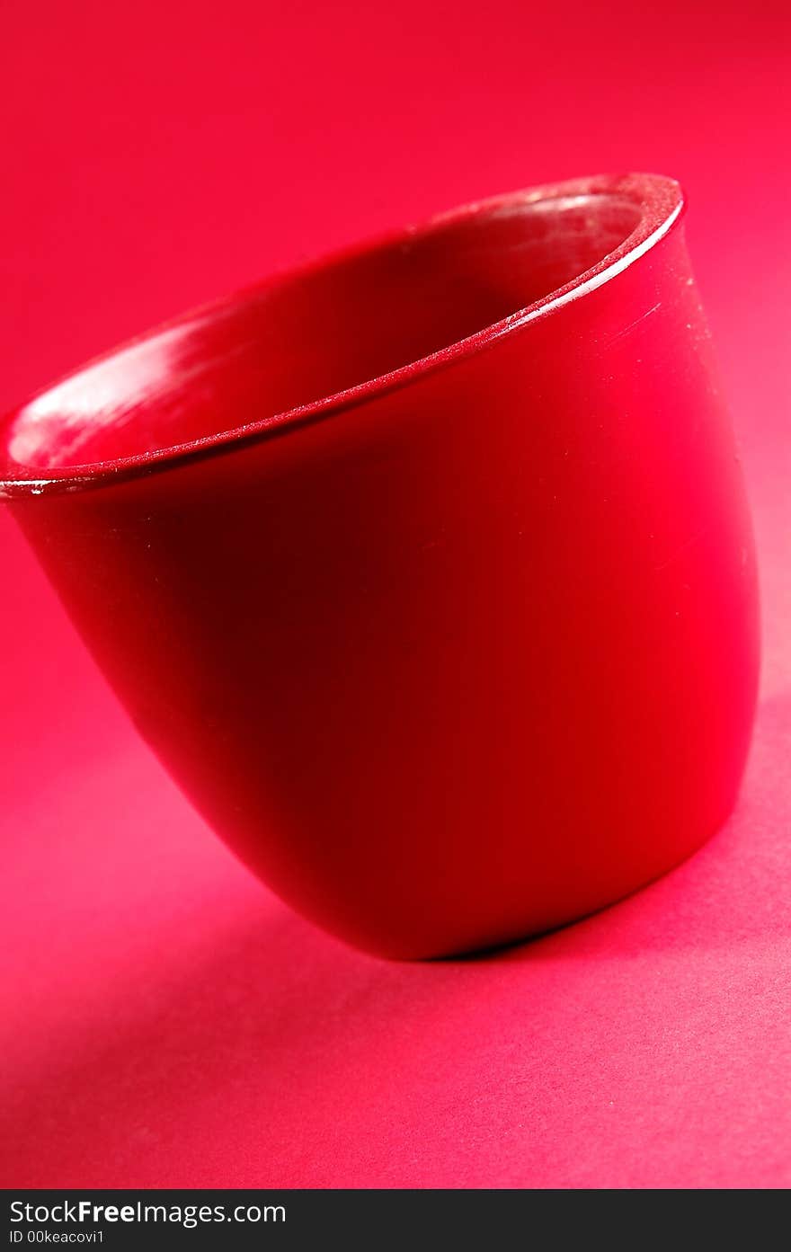 Photo of red vessel isolated on the red background