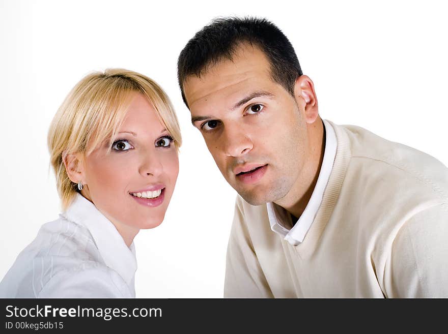 Casual portrait of a happy couple in 20s, white isolated