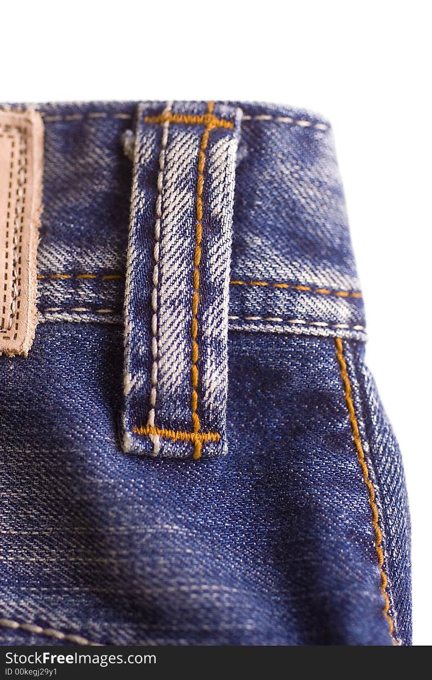 Detail shot of Fashionable faded light blue denim jeans. Detail shot of Fashionable faded light blue denim jeans.