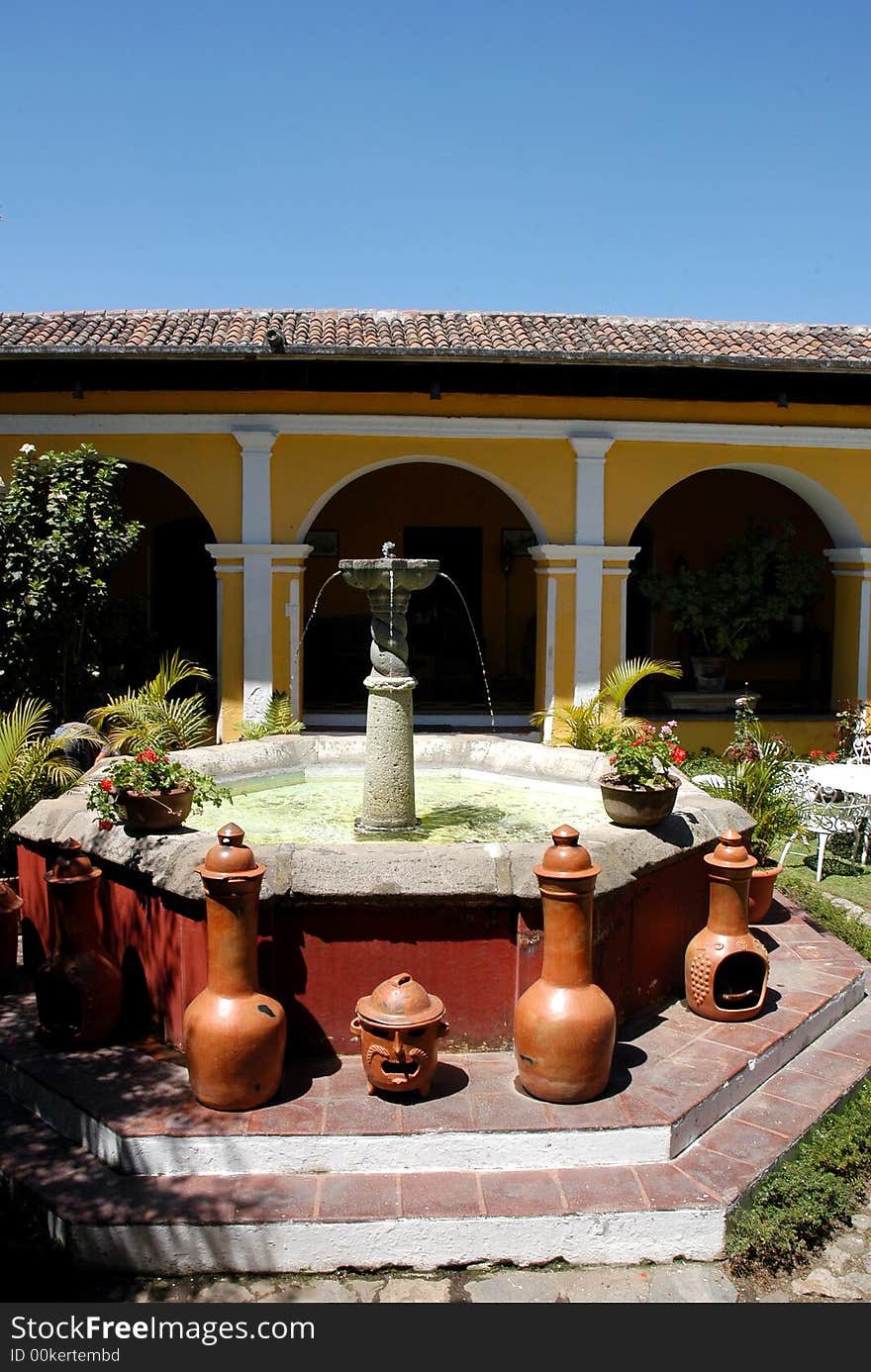 An house with a garden and fountain in the city of Antigua Guatemala. An house with a garden and fountain in the city of Antigua Guatemala