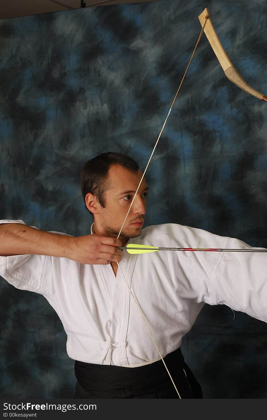 Portrait of archer man on a black background