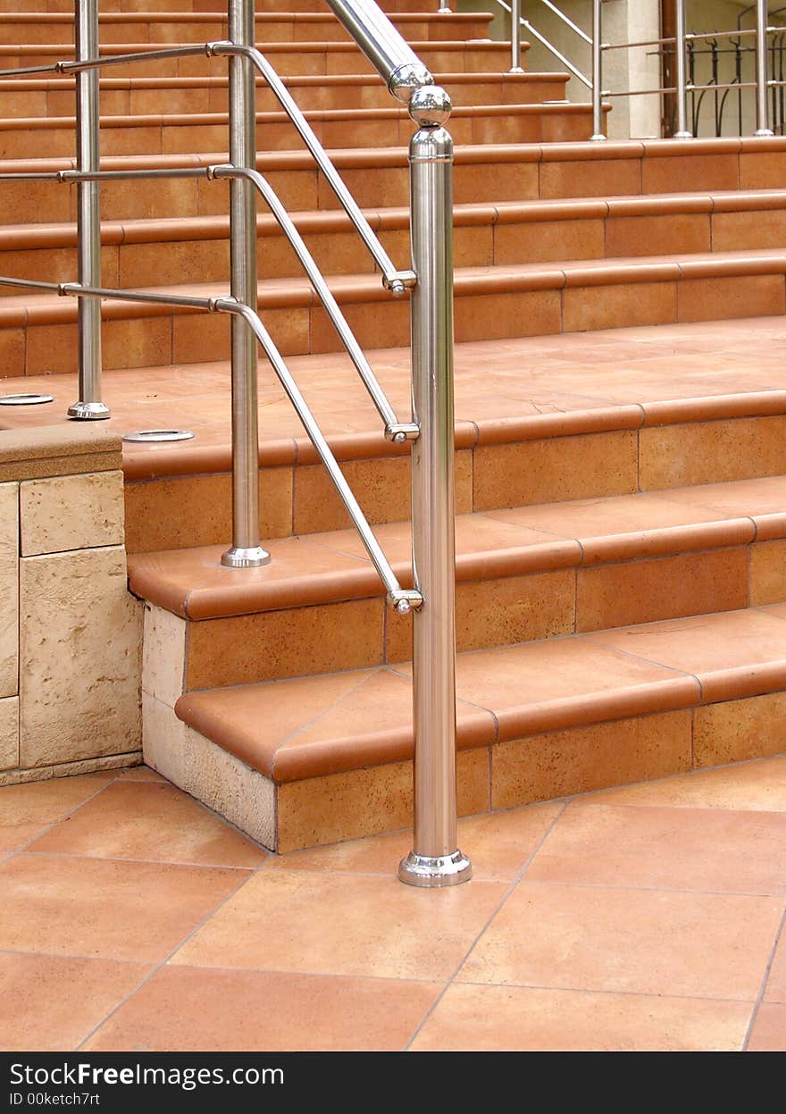 Front staircase with steel railing.