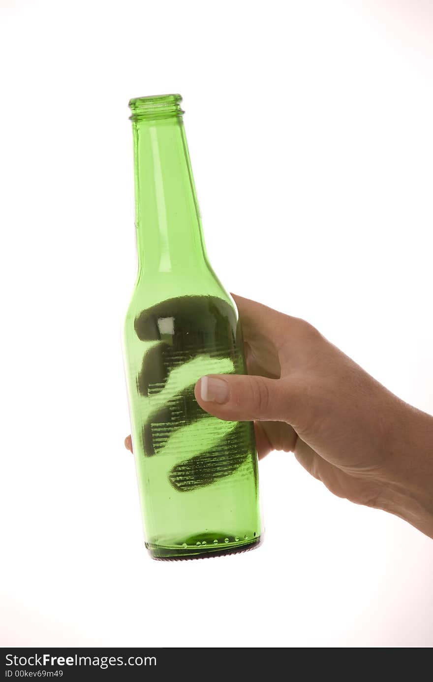 Female hand holding green bottle