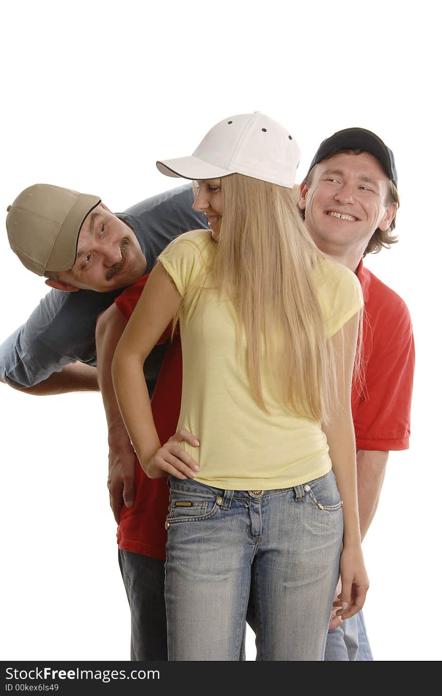 A man is looking at the girl and one man in red T-short is smiling behind girl's back. A man is looking at the girl and one man in red T-short is smiling behind girl's back