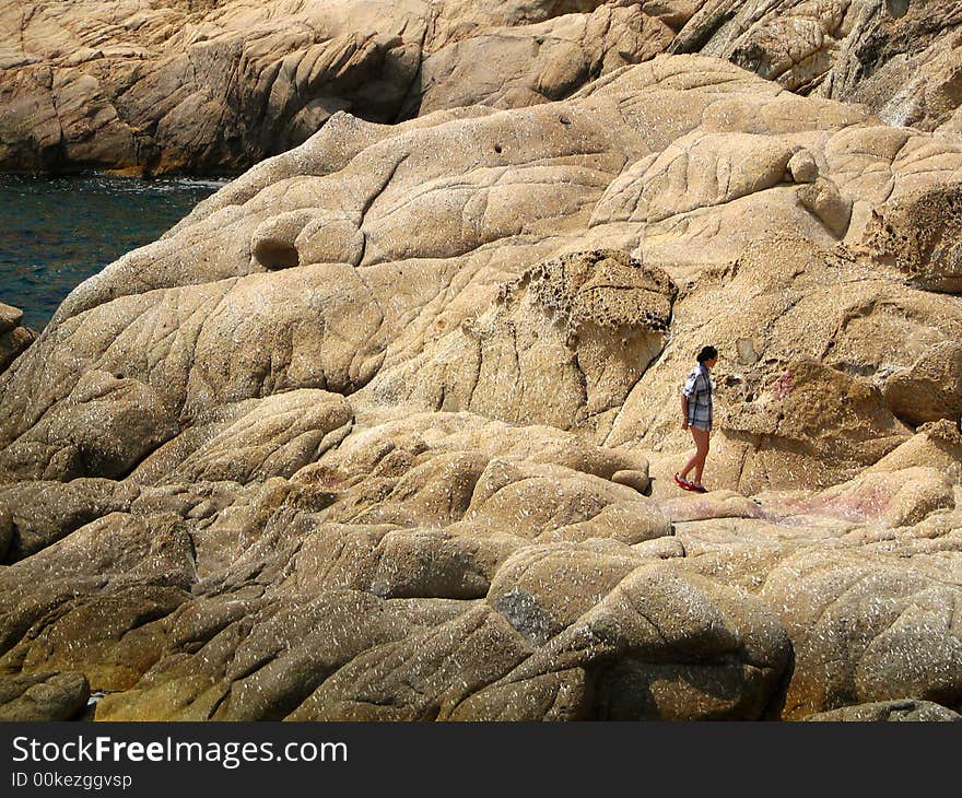 One woman on the rock. One woman on the rock