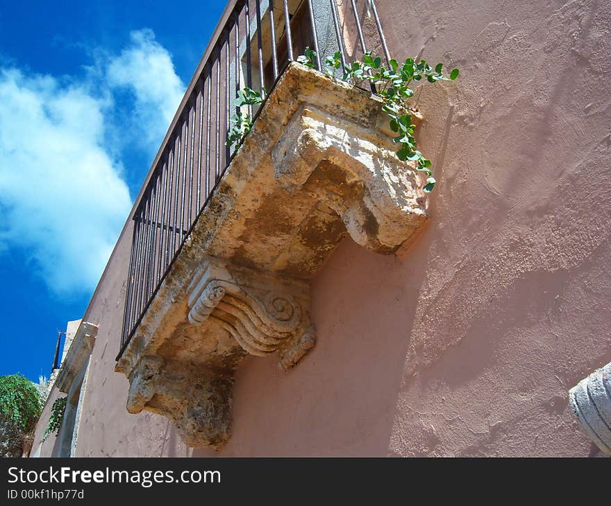 Old balcony on historic building Milazzo, Messina Itali