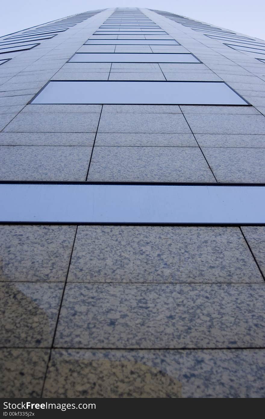 Looking up on a modern office glass building. Looking up on a modern office glass building