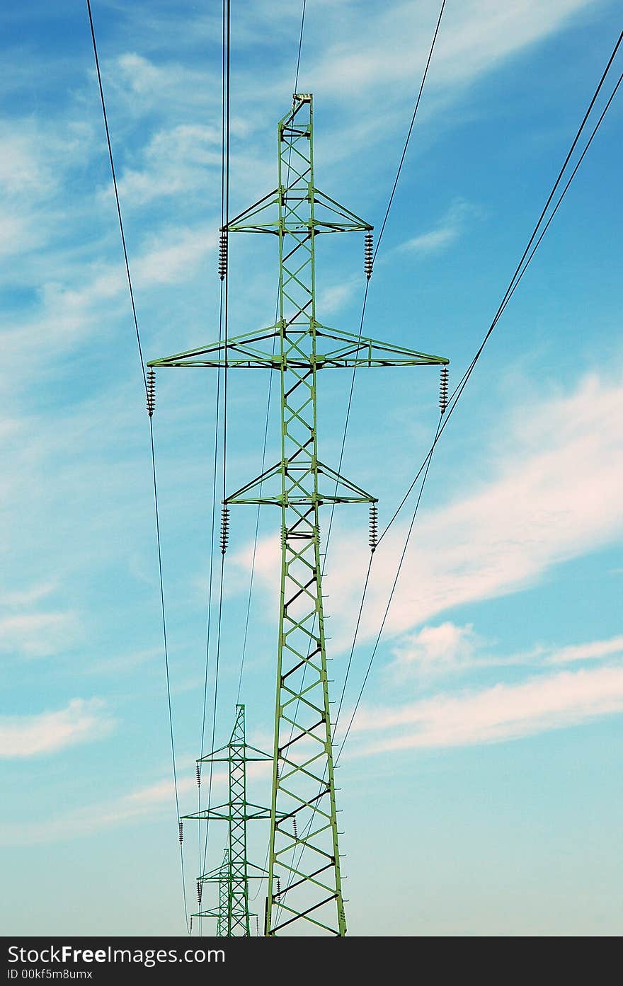 High voltage tower over cloudy blue sky. High voltage tower over cloudy blue sky