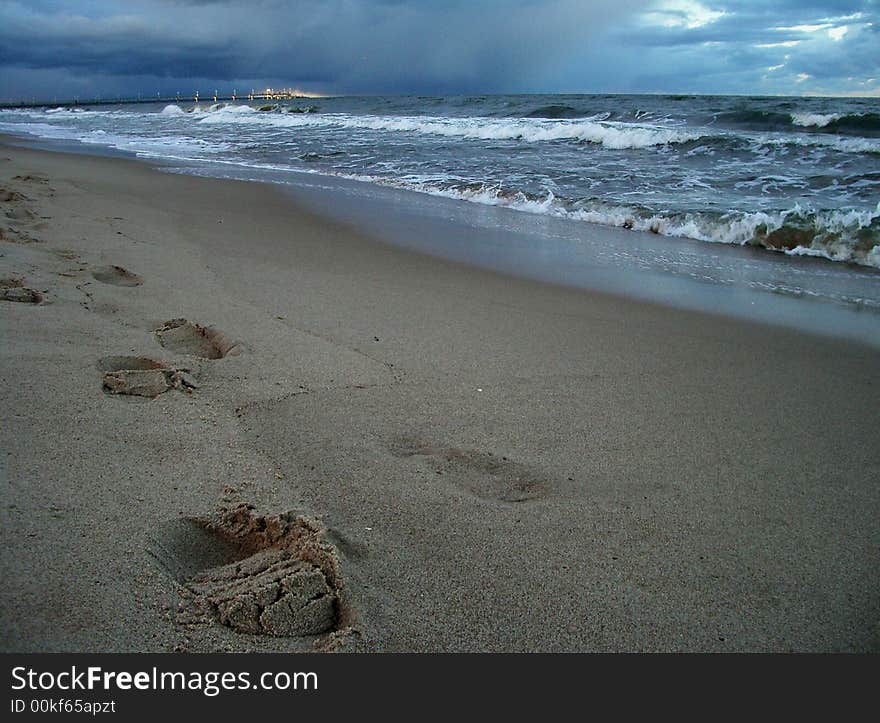 Feet track in the sand