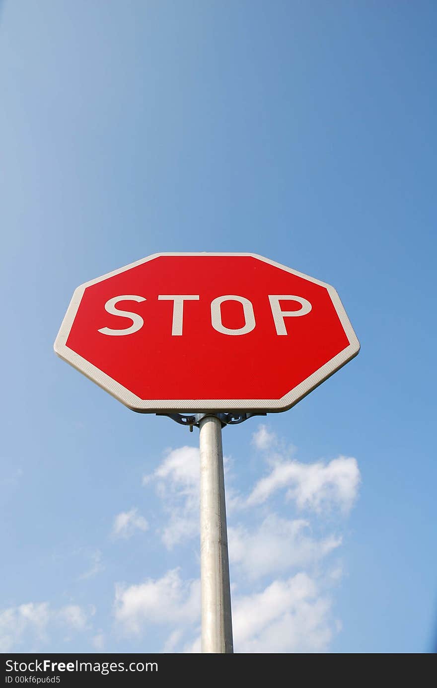 Stop sign. white text stop in red plate. Stop sign. white text stop in red plate