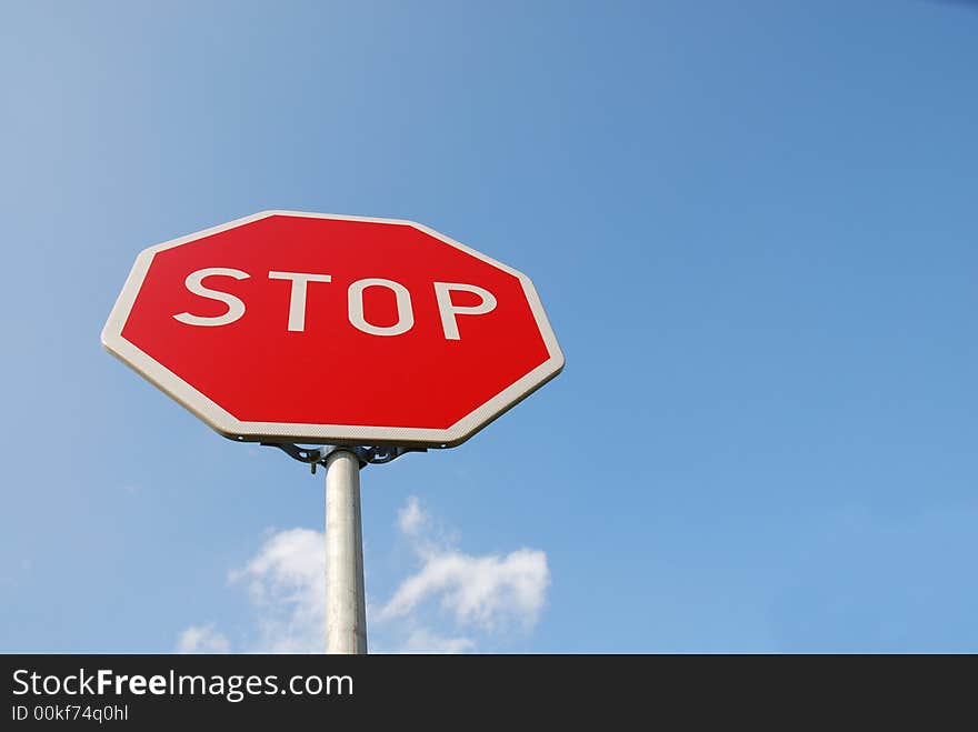 Stop sign. white text stop in red plate