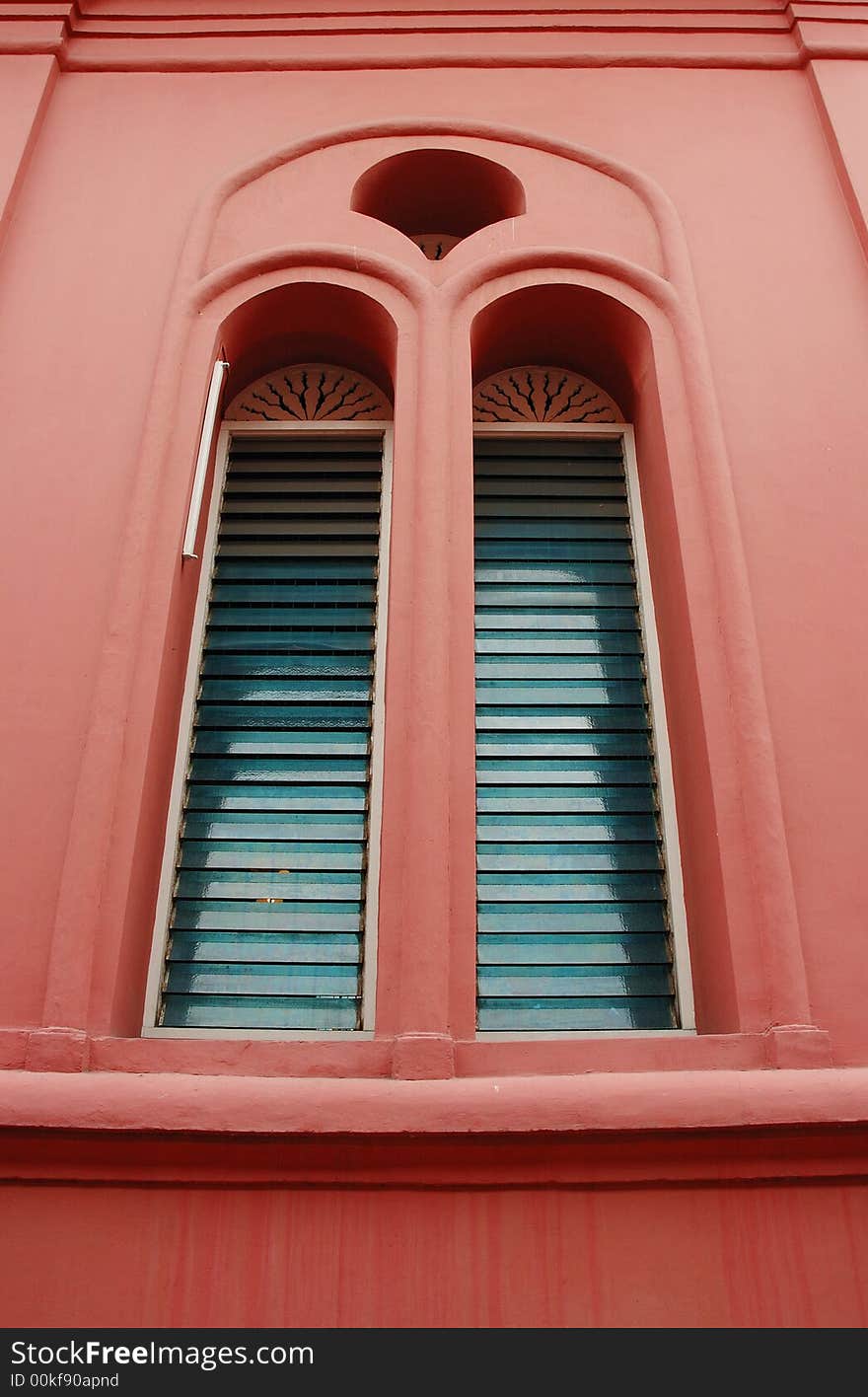 A window of an old colorful building. A window of an old colorful building