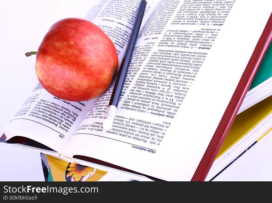 Books and apple