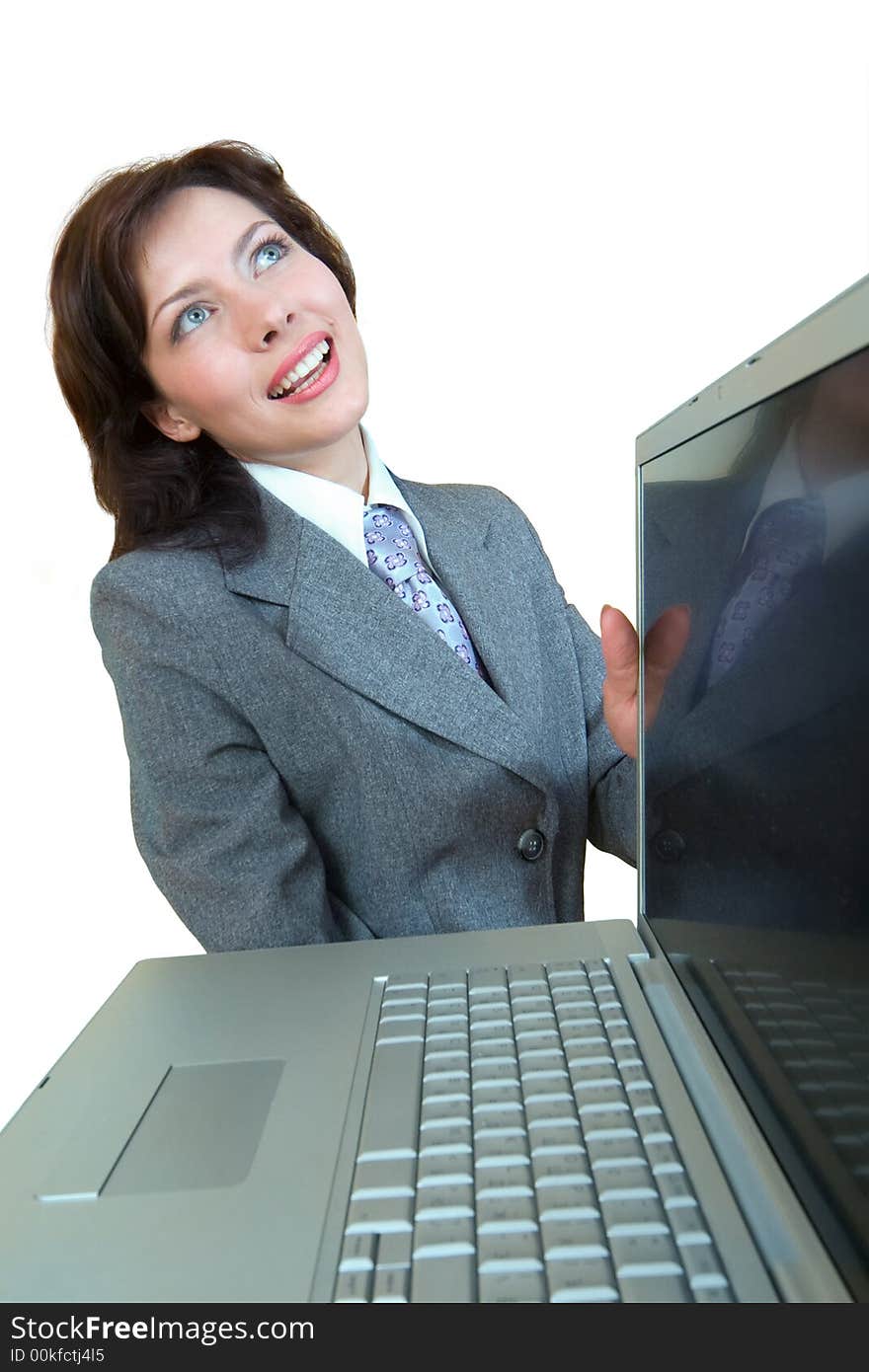 Smiling girl with laptop in her hands. Isolated on white background