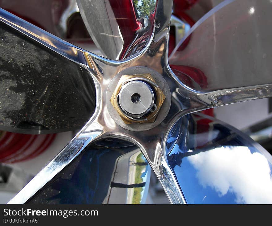 Shiny expensive new propeller on a racing boat.