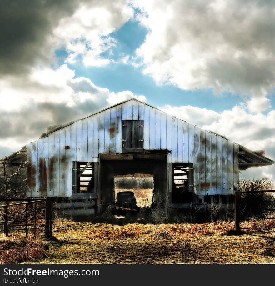 Run-Down Blue Barn on a Cloudy Day