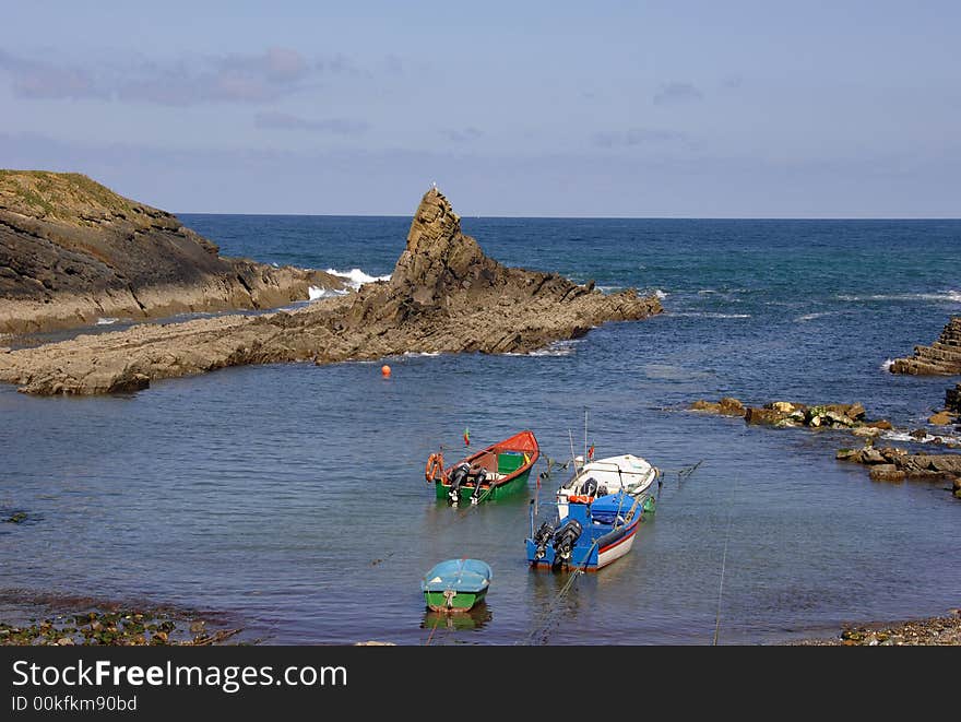 Typical and colored boats in small port of fish