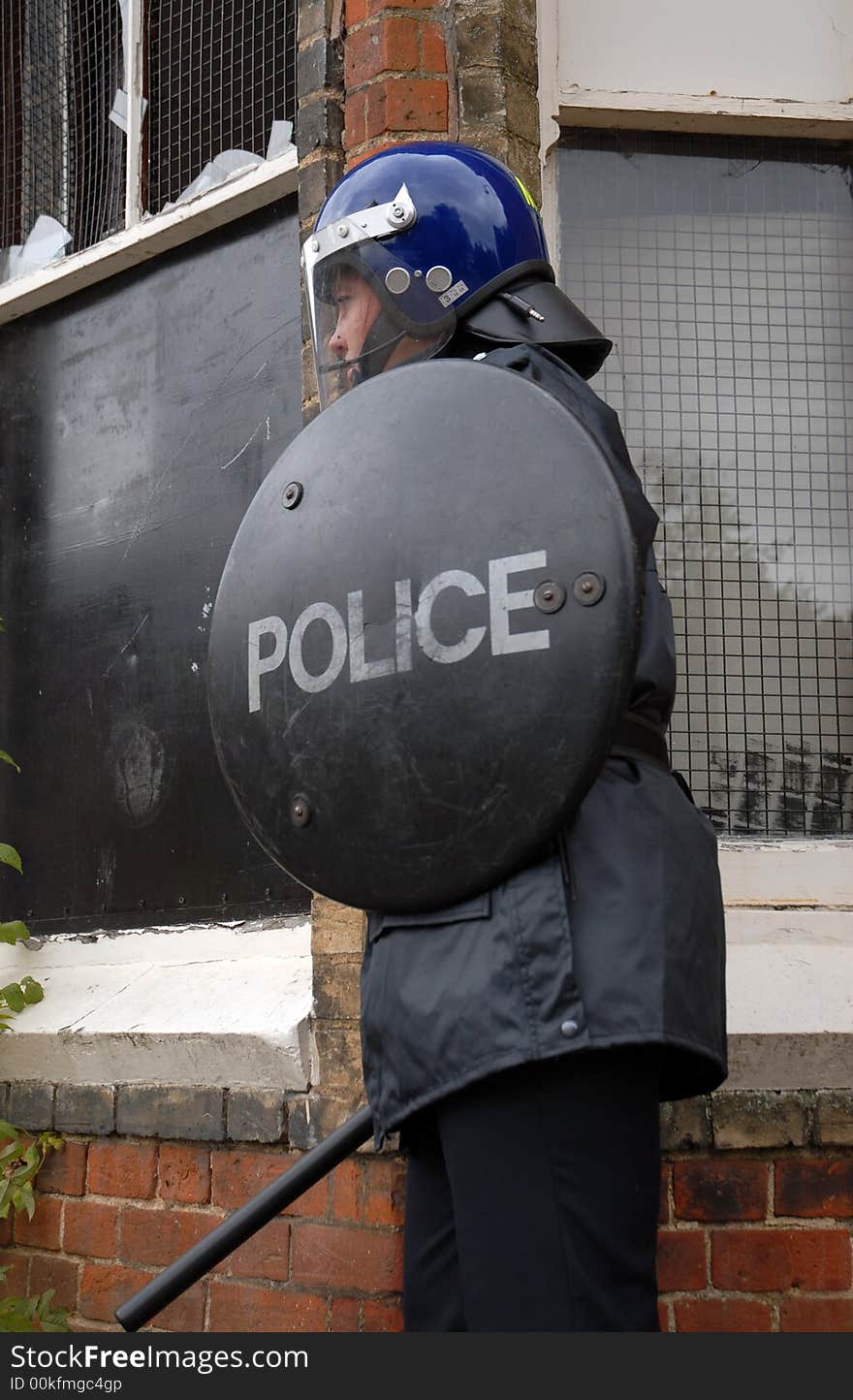 Female British Police Officer in Riot equipment. Female British Police Officer in Riot equipment.