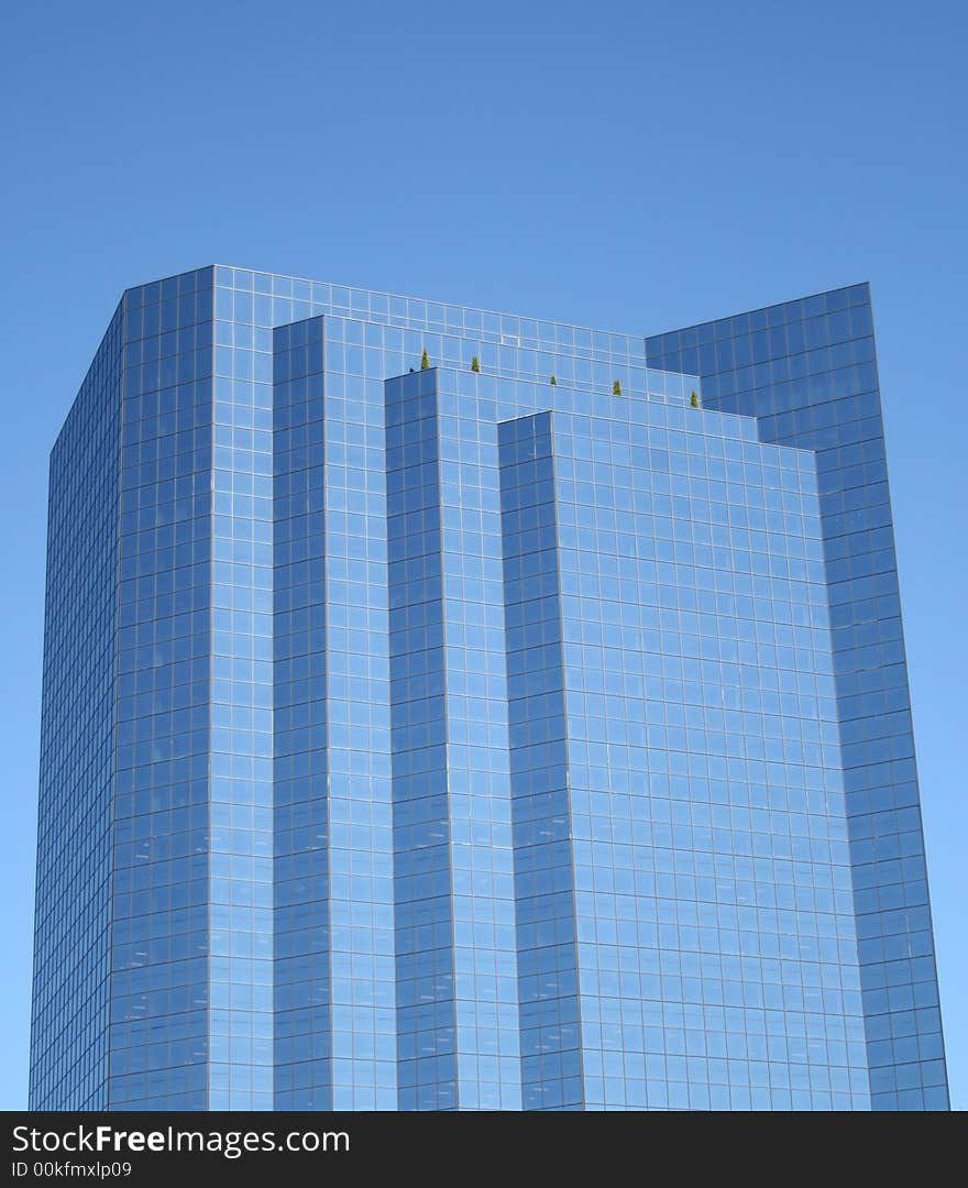 A new skyscraper reflects the blue sky in Bellevue, Washington. A new skyscraper reflects the blue sky in Bellevue, Washington.