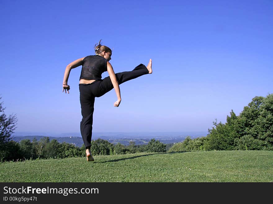 Punch - attractive young woman practising self defense