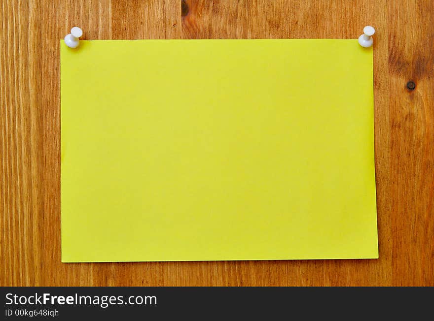 Single blank sheet attached to a wooden wall. Single blank sheet attached to a wooden wall