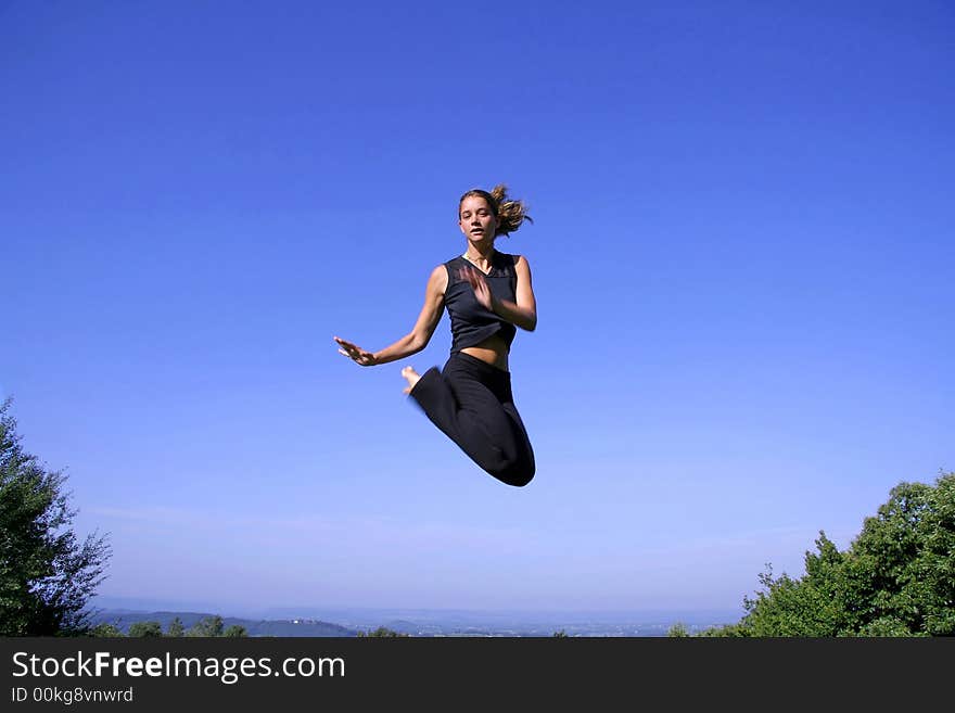 Attractive young woman practising self defense