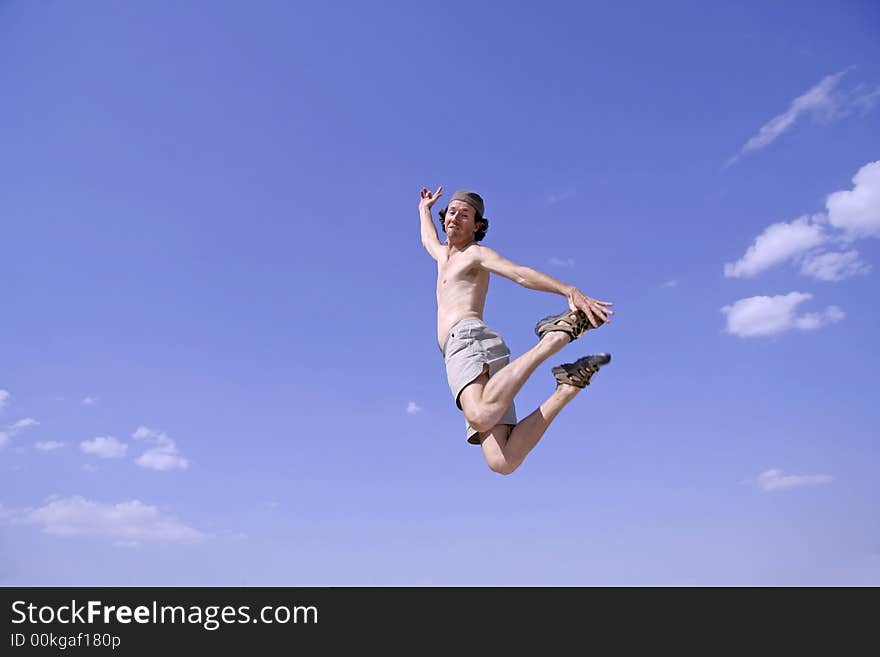 Healthy happy man jumping in joy of life