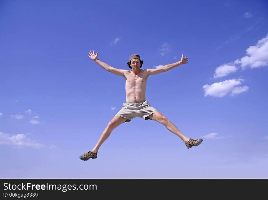 Healthy happy man jumping in joy of life