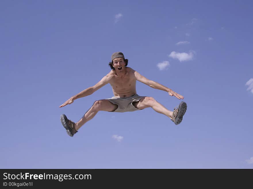 Healthy happy man jumping in joy of life