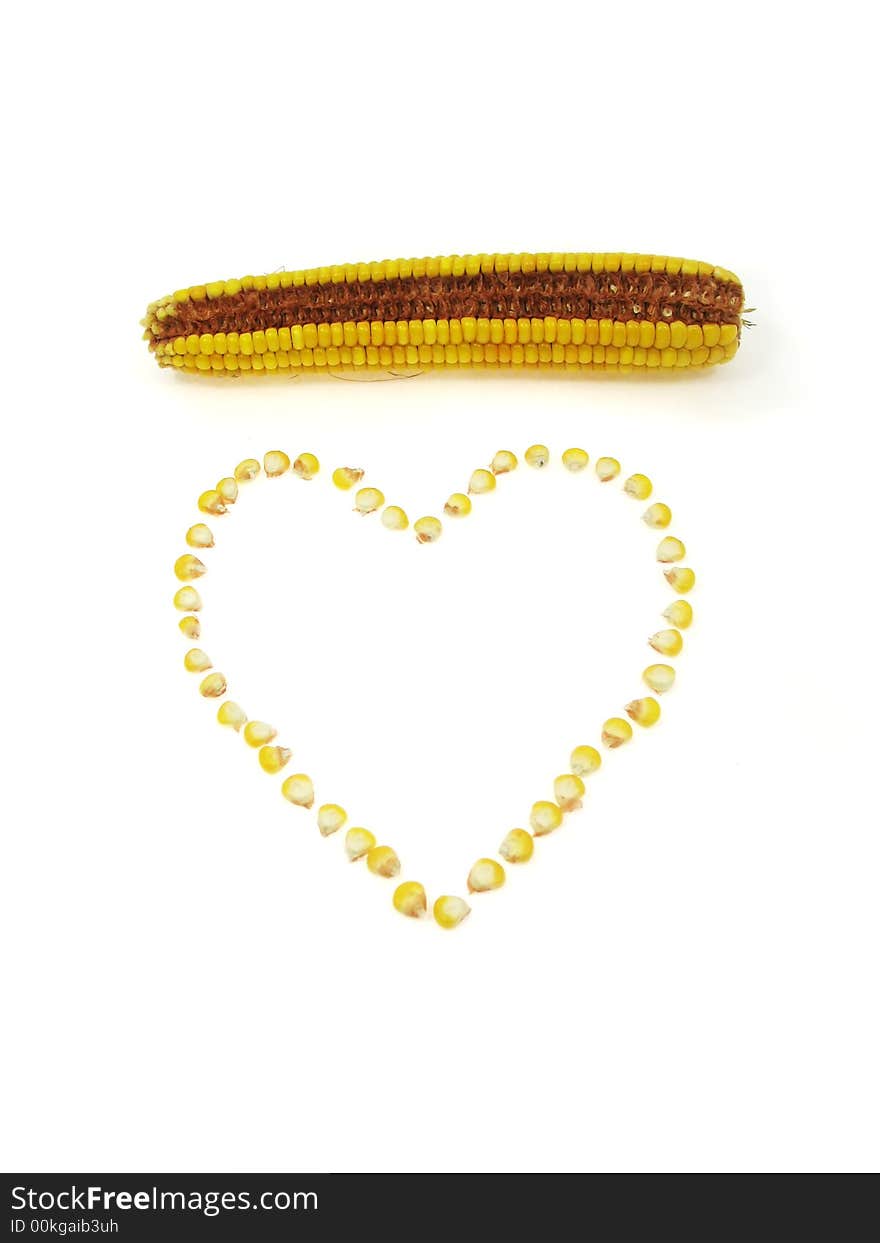 A heart of sweet corn kernels isolated on a white background. A heart of sweet corn kernels isolated on a white background