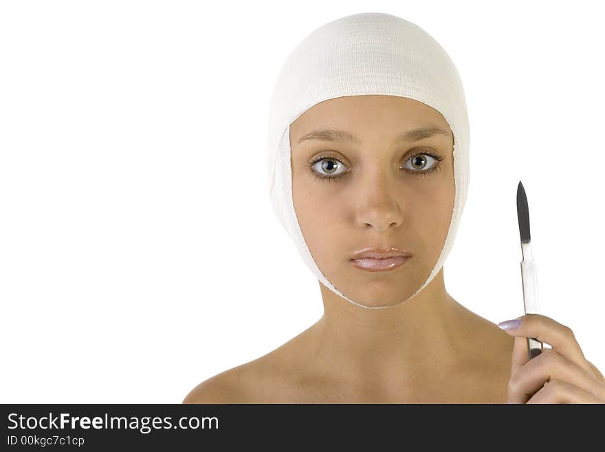 Young, beautiful woman with bandage on head and scalpel in hand. Looking at camera. Front view, white background. Young, beautiful woman with bandage on head and scalpel in hand. Looking at camera. Front view, white background