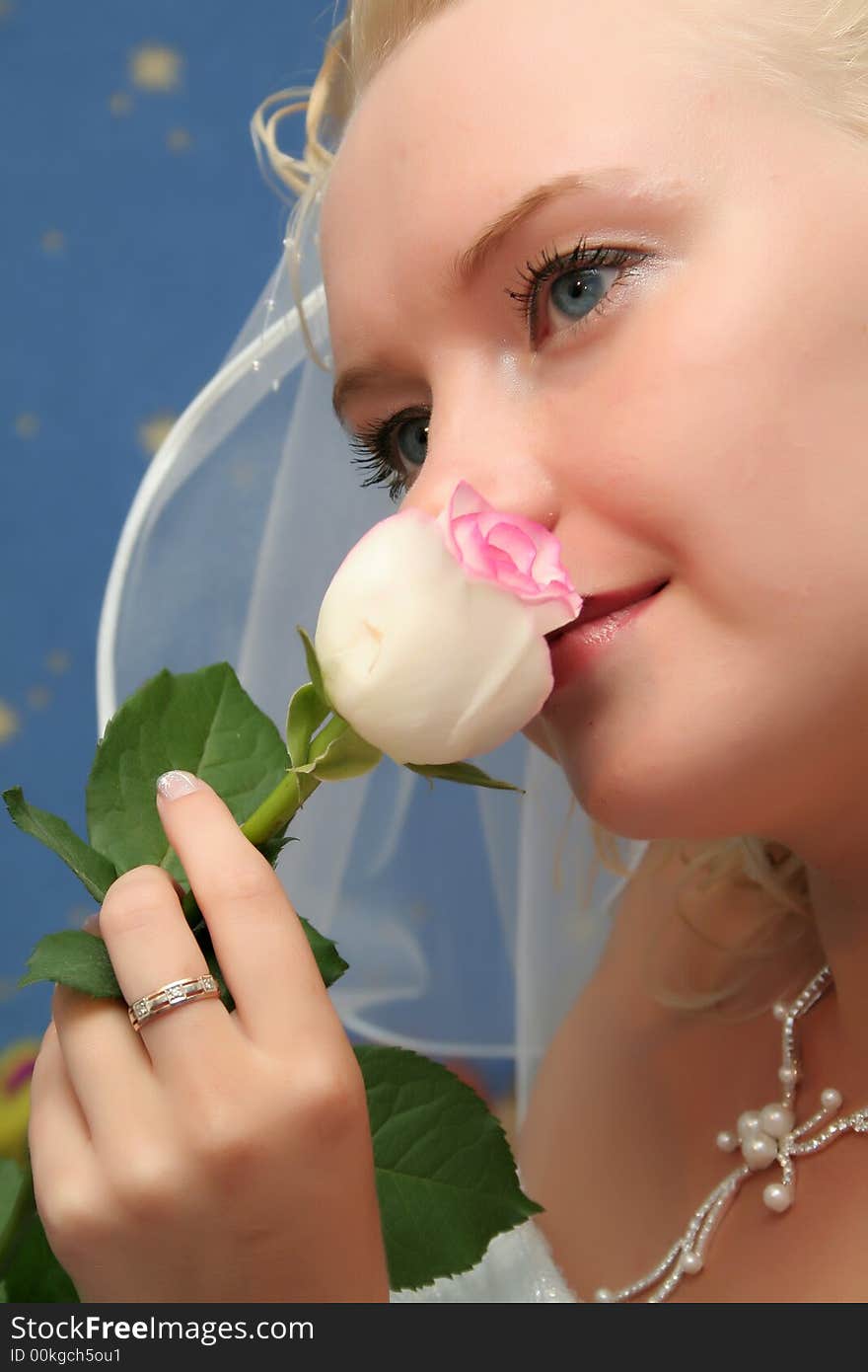 Beautiful bride with pink rose