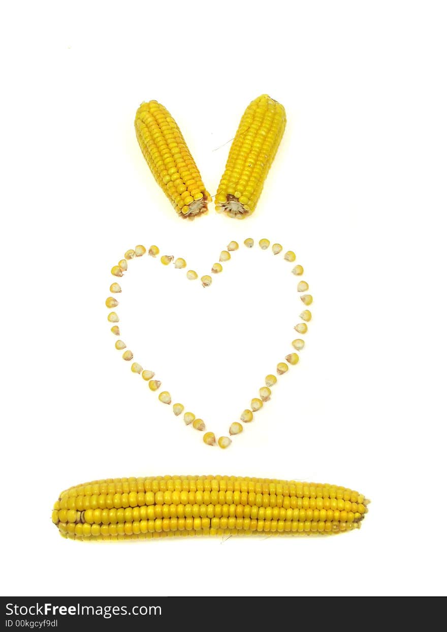 A heart of sweet corn kernels isolated on a white background. A heart of sweet corn kernels isolated on a white background