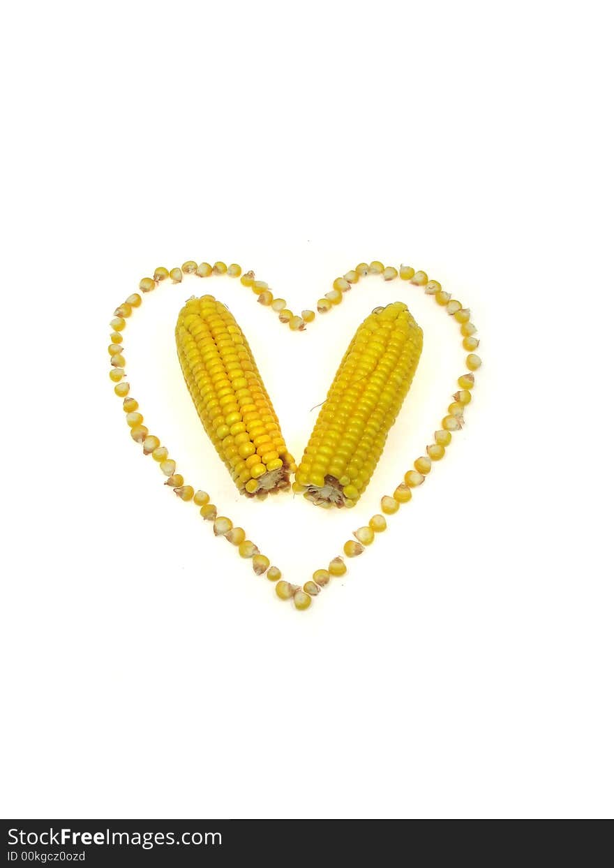 A heart of sweet corn kernels isolated on a white background. A heart of sweet corn kernels isolated on a white background