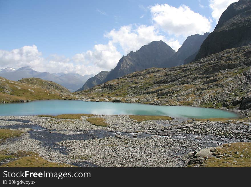 Mountain scenery with a blue mountain lake in front. Mountain scenery with a blue mountain lake in front