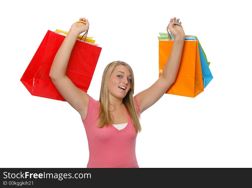 Teen girl with shopping bags isolated on white