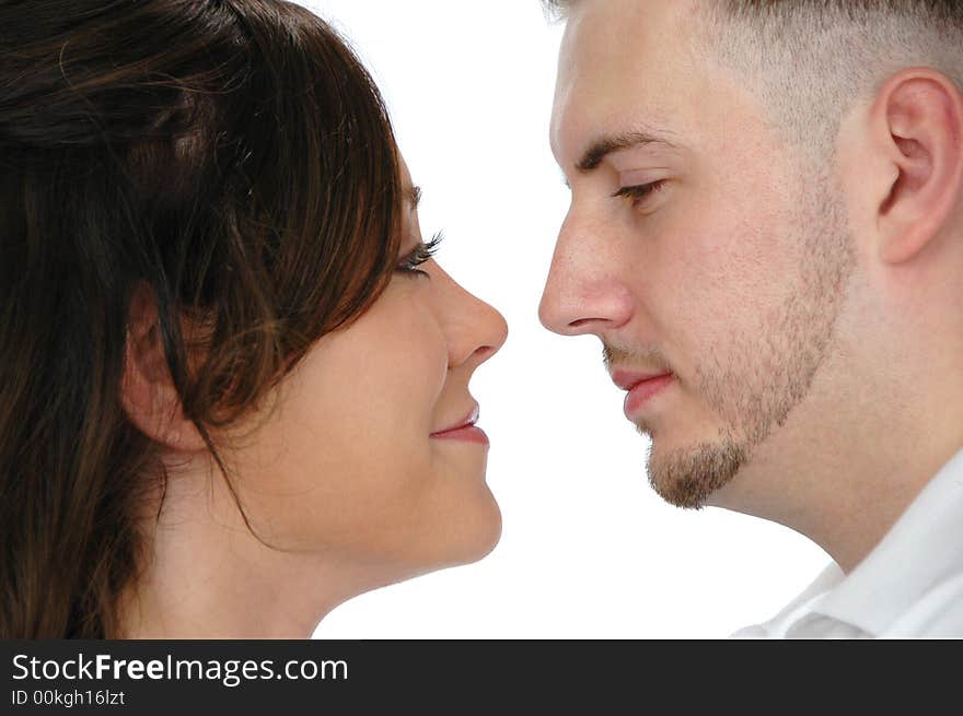 Young couple looking at each other isolated on white