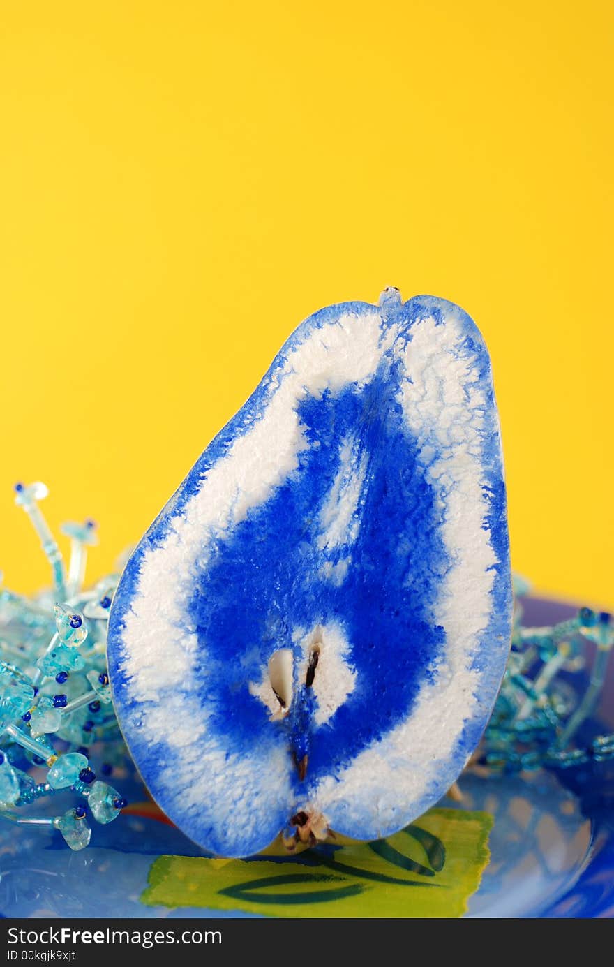 Slice of pear on a blue plate