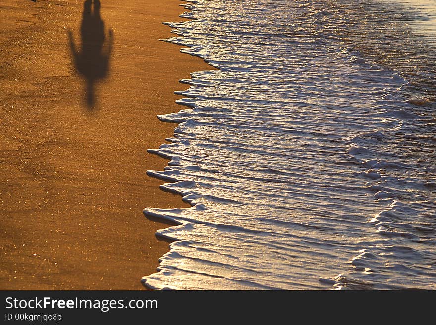 Shade on a beach on a background sea