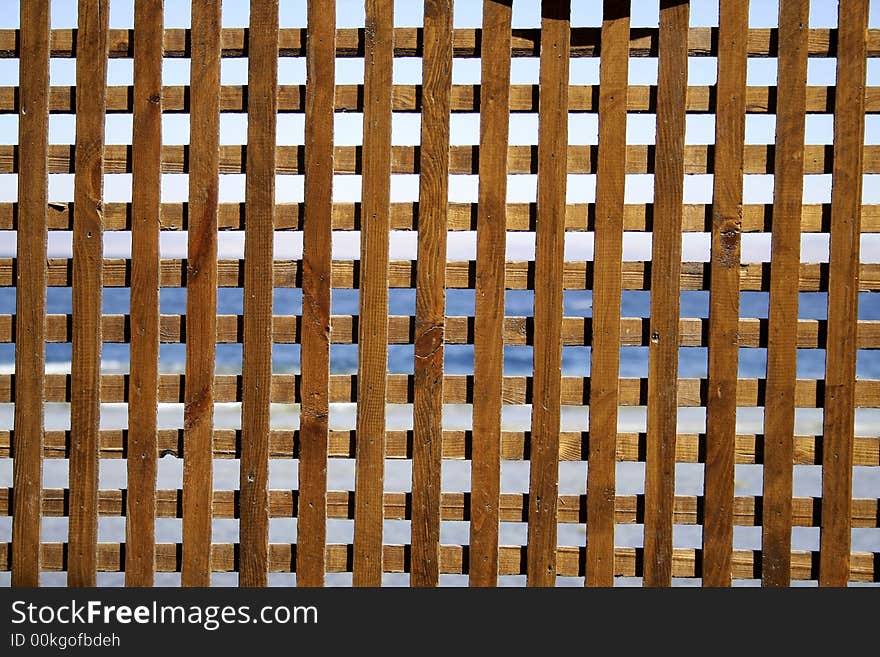 Wooden fence pattern on red sea background, sinai, egypt