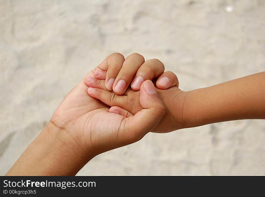 A man holding child's hand. A man holding child's hand.